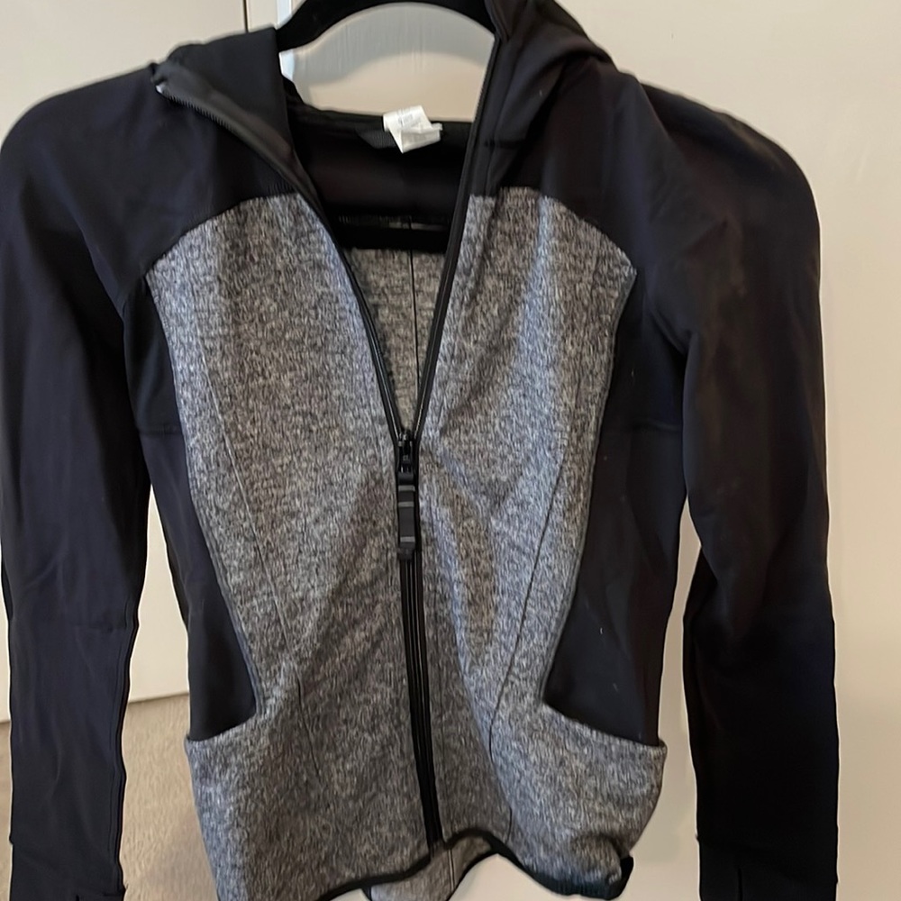 Athletic gray and black zip jacket with hood